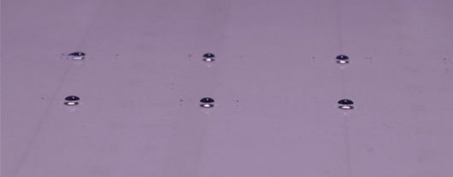 Liquid jets break up more readily on a substrate